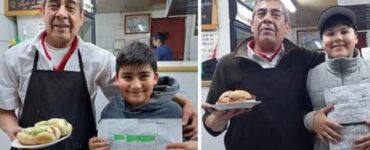 commerciante premia i bambini che studiano con uno dei suoi panini
